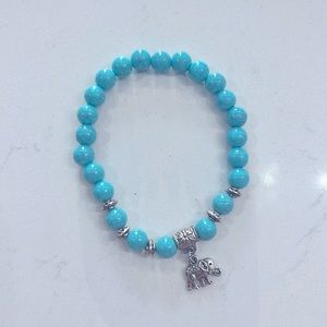 Turquoise stone bracelet with elephant charm